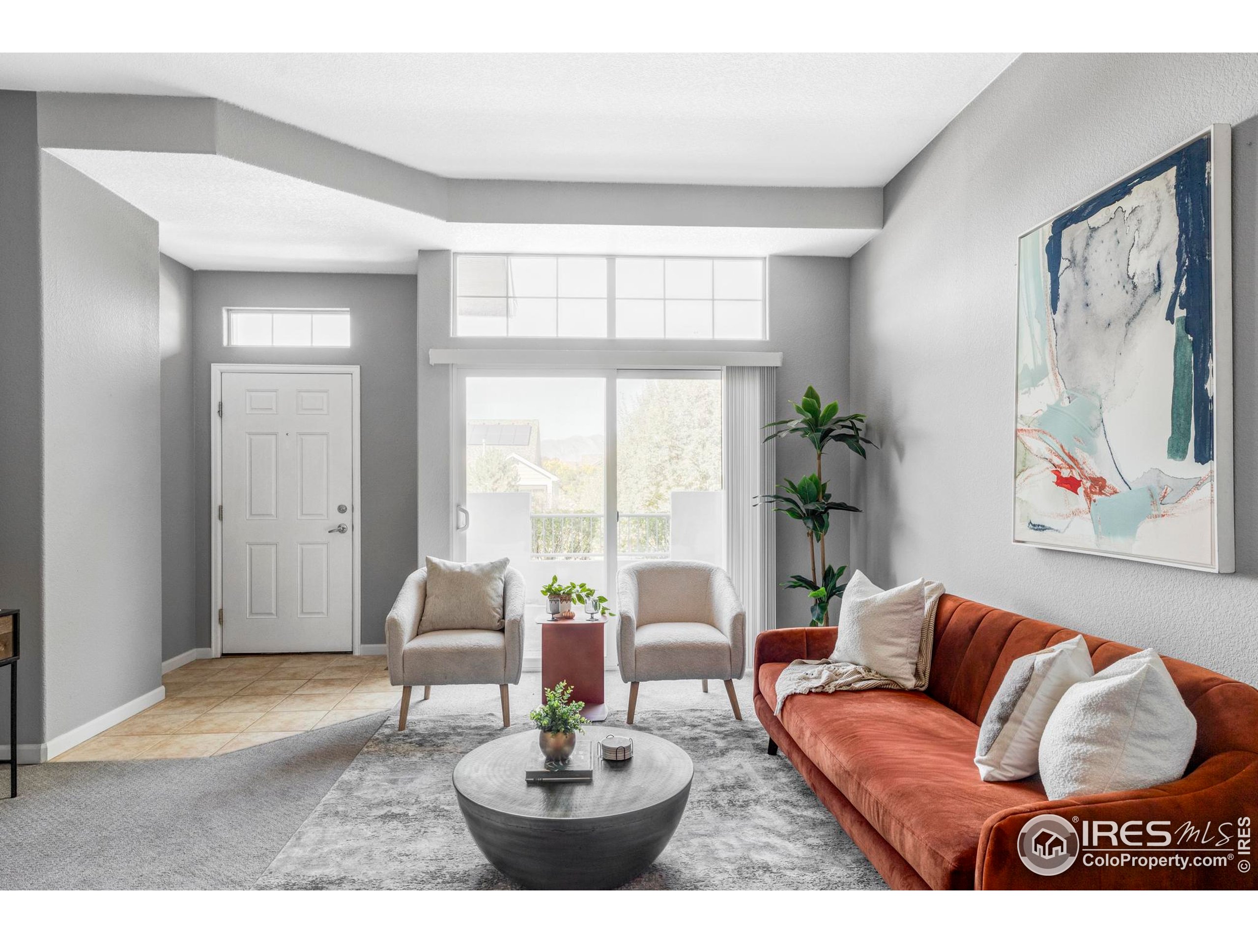 4240 Riley Drive Longmont, CO 80503 - Photo 7 of 25 a living room with furniture and a large window