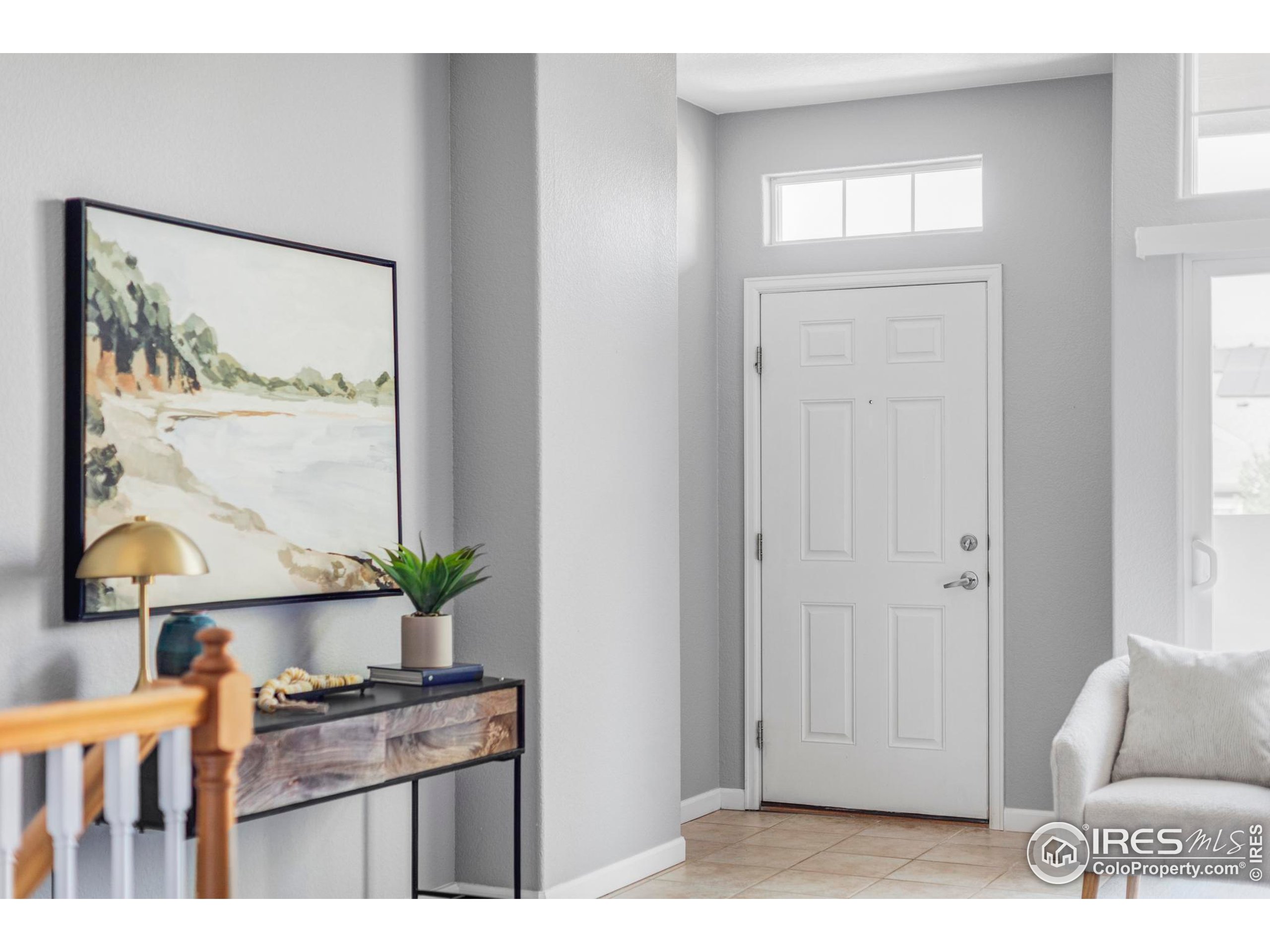 4240 Riley Drive Longmont, CO 80503 - Photo 8 of 25 a kitchen view with couches and wooden floor