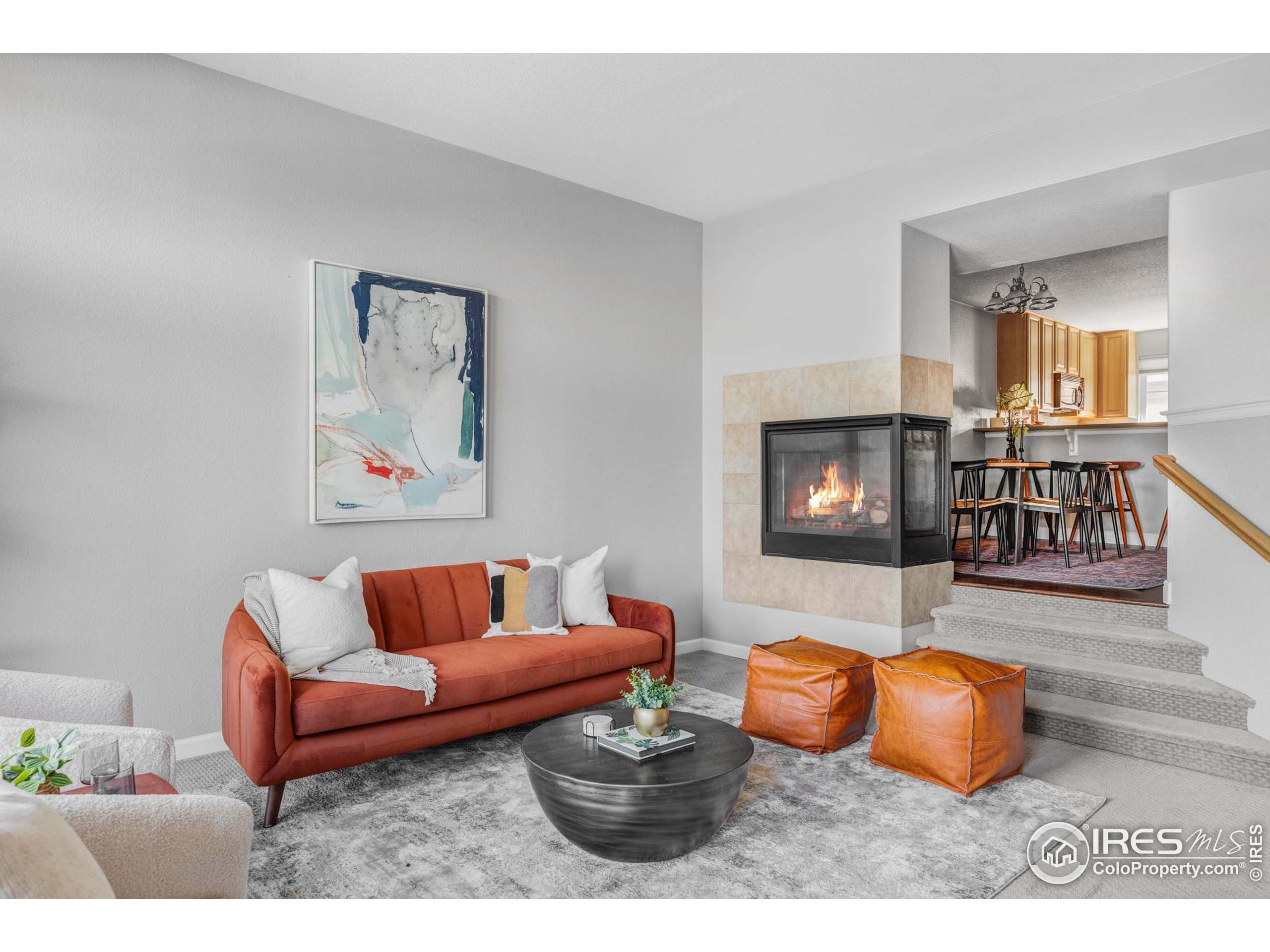 4240 Riley Drive Longmont, CO 80503 - Photo 9 of 25 a living room with furniture and a flat screen tv