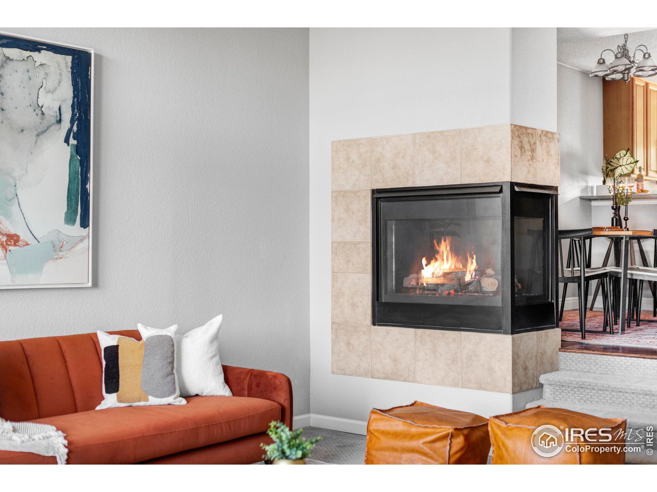 4240 Riley Drive Longmont, CO 80503 - Photo 10 of 25 a living room with furniture and a fireplace