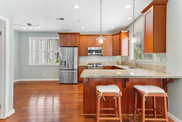a kitchen with dining table and chairs
