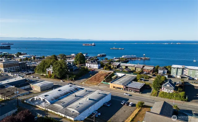 a view of a backyard with sitting area