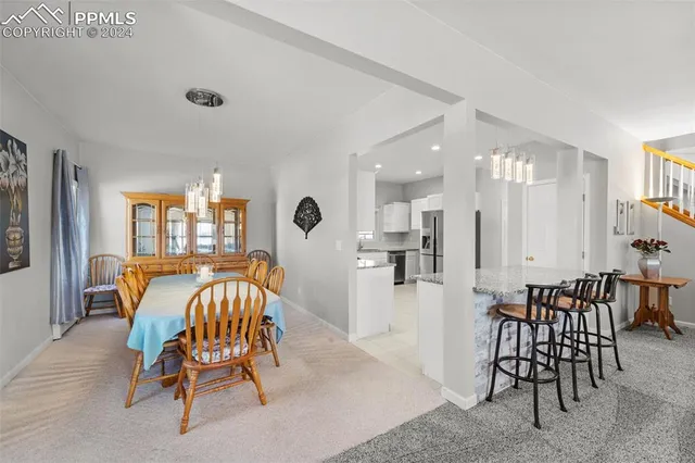 a view of a dining room with furniture
