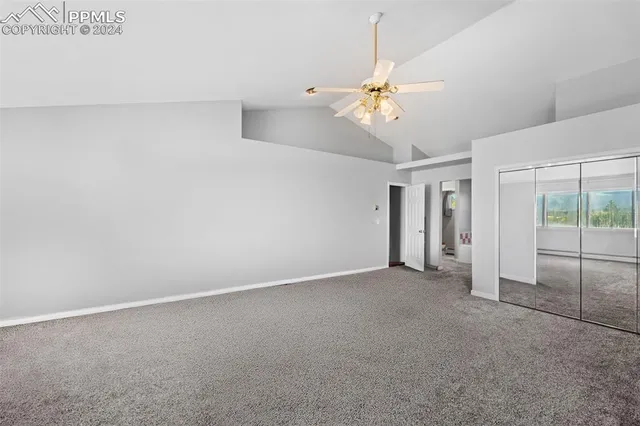 a bathroom with a tub a sink and mirror