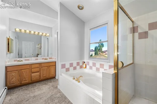 a bathroom with a bathtub and a shower