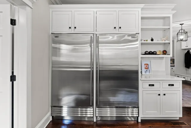 a utility room with sink dryer and washer