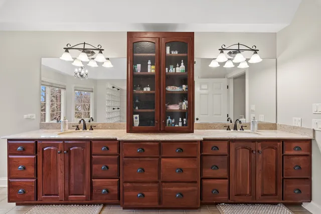 a bedroom with a bed and a mirror