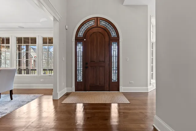 a view of a dining room with furniture wooden floor and a chandelier
