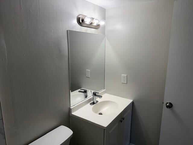 600 Southwest 2nd Avenue, Unit 140 Boca Raton, FL 33432 - Photo 22 of 30 a bathroom with a sink toilet and mirror