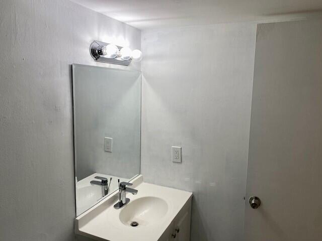 600 Southwest 2nd Avenue, Unit 140 Boca Raton, FL 33432 - Photo 8 of 30 a bathroom with a sink and a mirror
