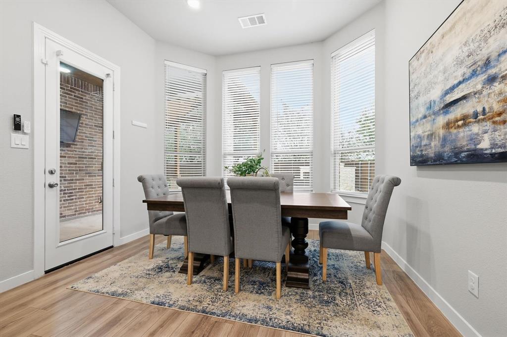 2912 Winding Ridge Court Little Elm, TX 75068 - Photo 18 of 40 Dining Space right off the kitchen with a bow windows and flood of natural light.
