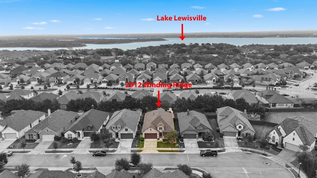 2912 Winding Ridge Court Little Elm, TX 75068 - Photo 10 of 40 Aerial perspective of suburban area with a nearby body of water