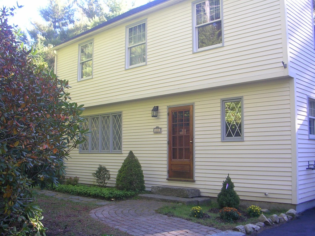 7 Hay Road Ashburnham, MA 01430 - Photo 1 of 15 a view of a house with a yard and a garage