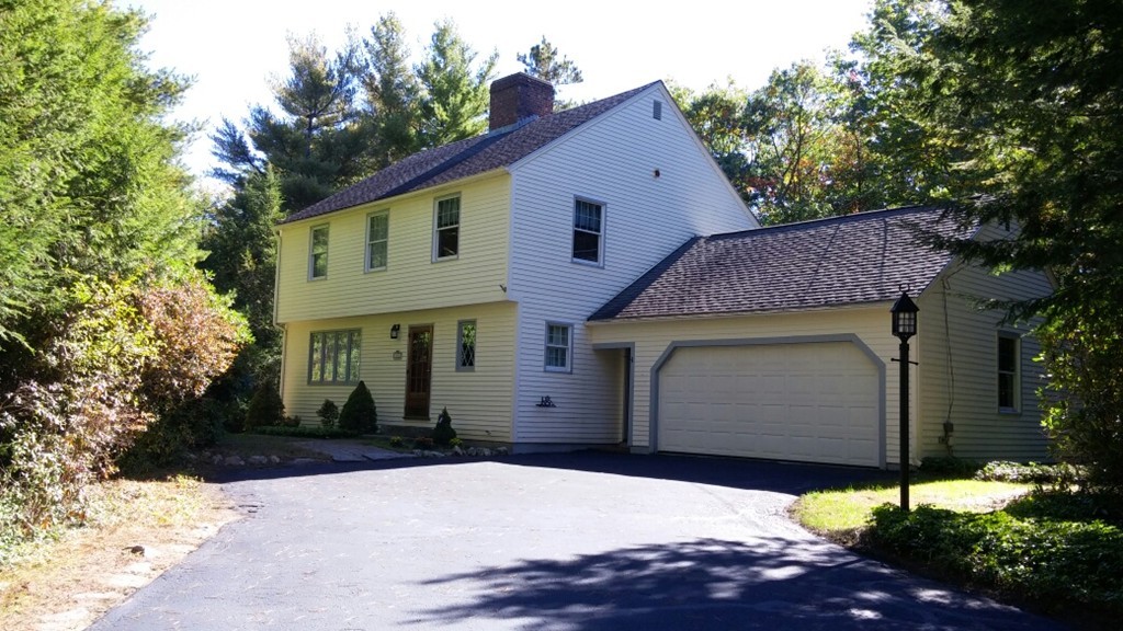 7 Hay Road Ashburnham, MA 01430 - Photo 2 of 15 a front view of a house with a yard and garage