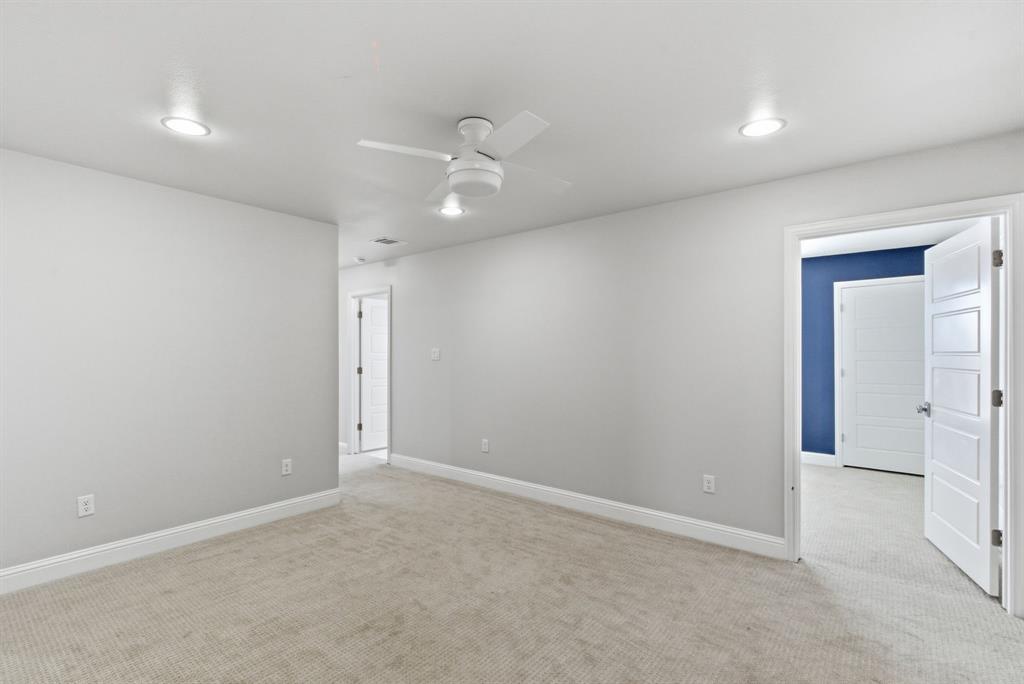 4600 Old Brock Road Weatherford, TX 76087 - Photo 27 of 37 Spacious room featuring neutral carpeting, light gray walls, recessed lighting, a ceiling fan, and white trim
