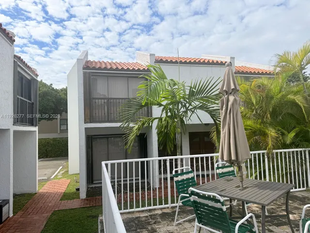 a view of a house with a iron gate