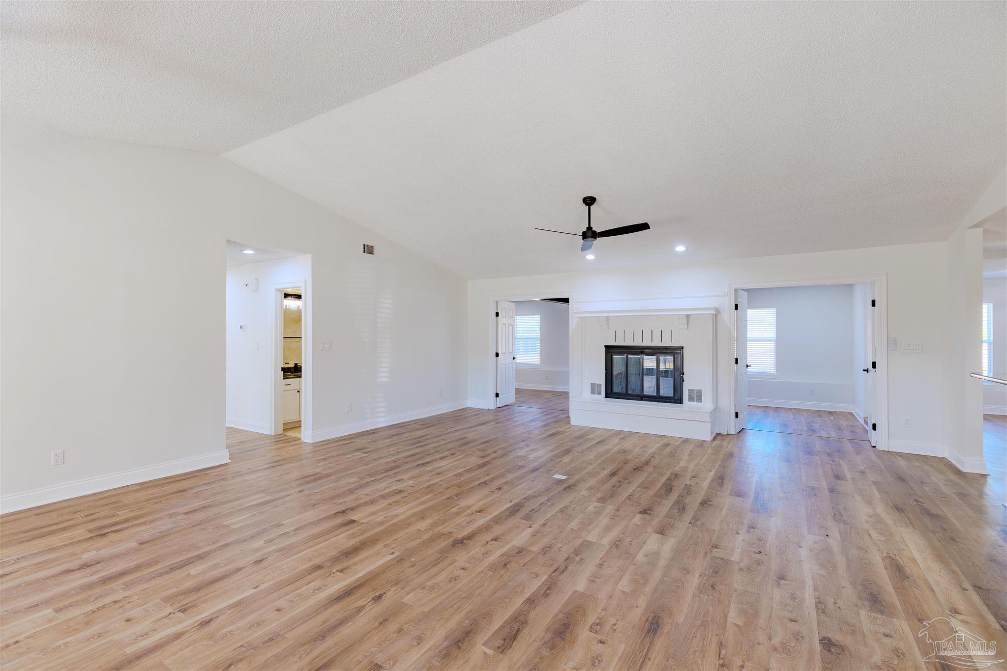 2115 Stallion Road Cantonment, FL 32533 - Photo 11 of 70 wooden floor in an empty room with a window