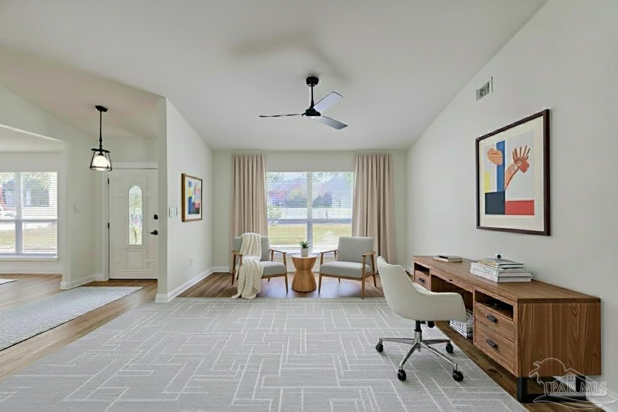 2115 Stallion Road Cantonment, FL 32533 - Photo 13 of 70 a view of a workspace with furniture and a window