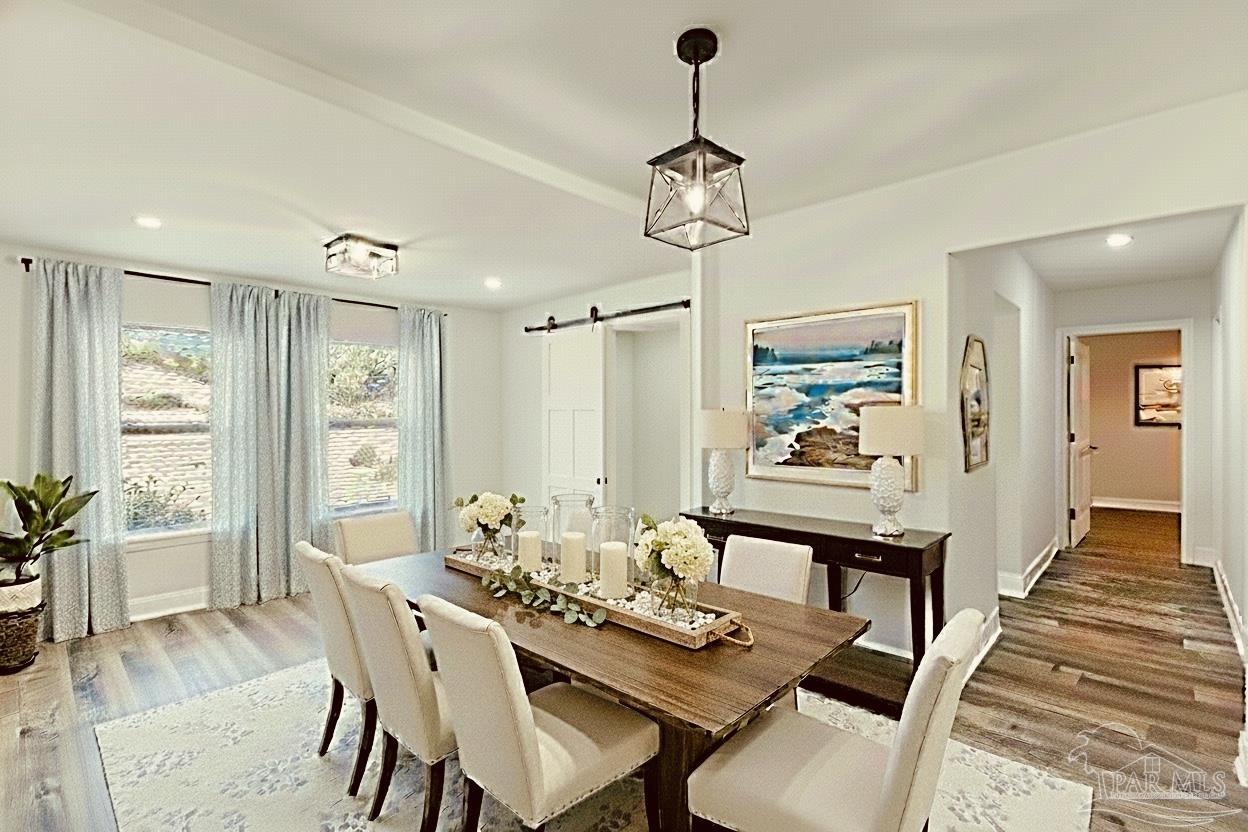 2115 Stallion Road Cantonment, FL 32533 - Photo 25 of 70 a view of a dining room with furniture window and wooden floor