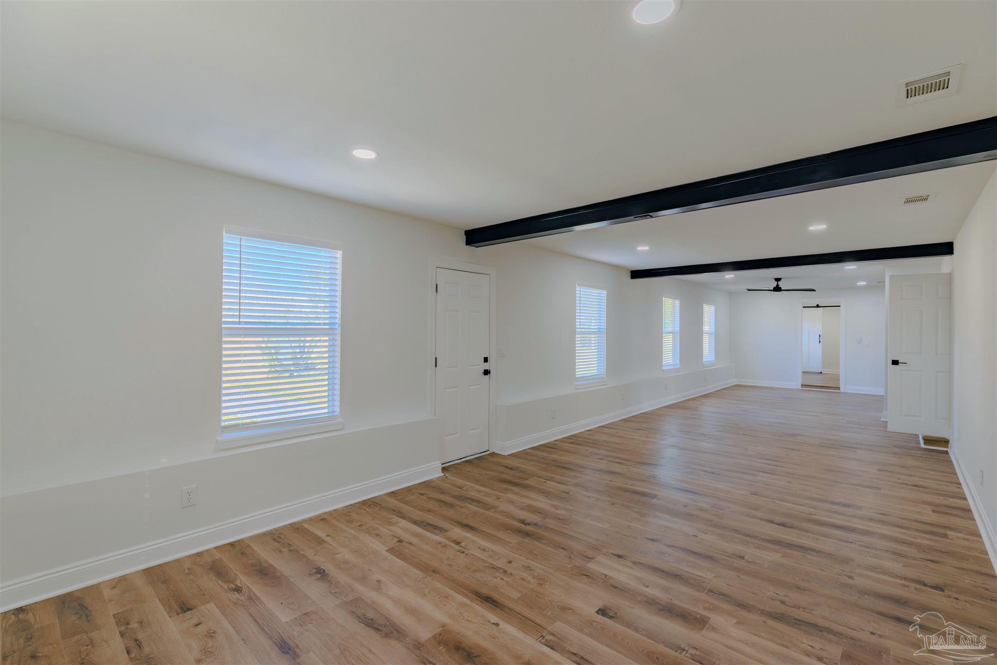 2115 Stallion Road Cantonment, FL 32533 - Photo 28 of 70 a view of empty room with wooden floor