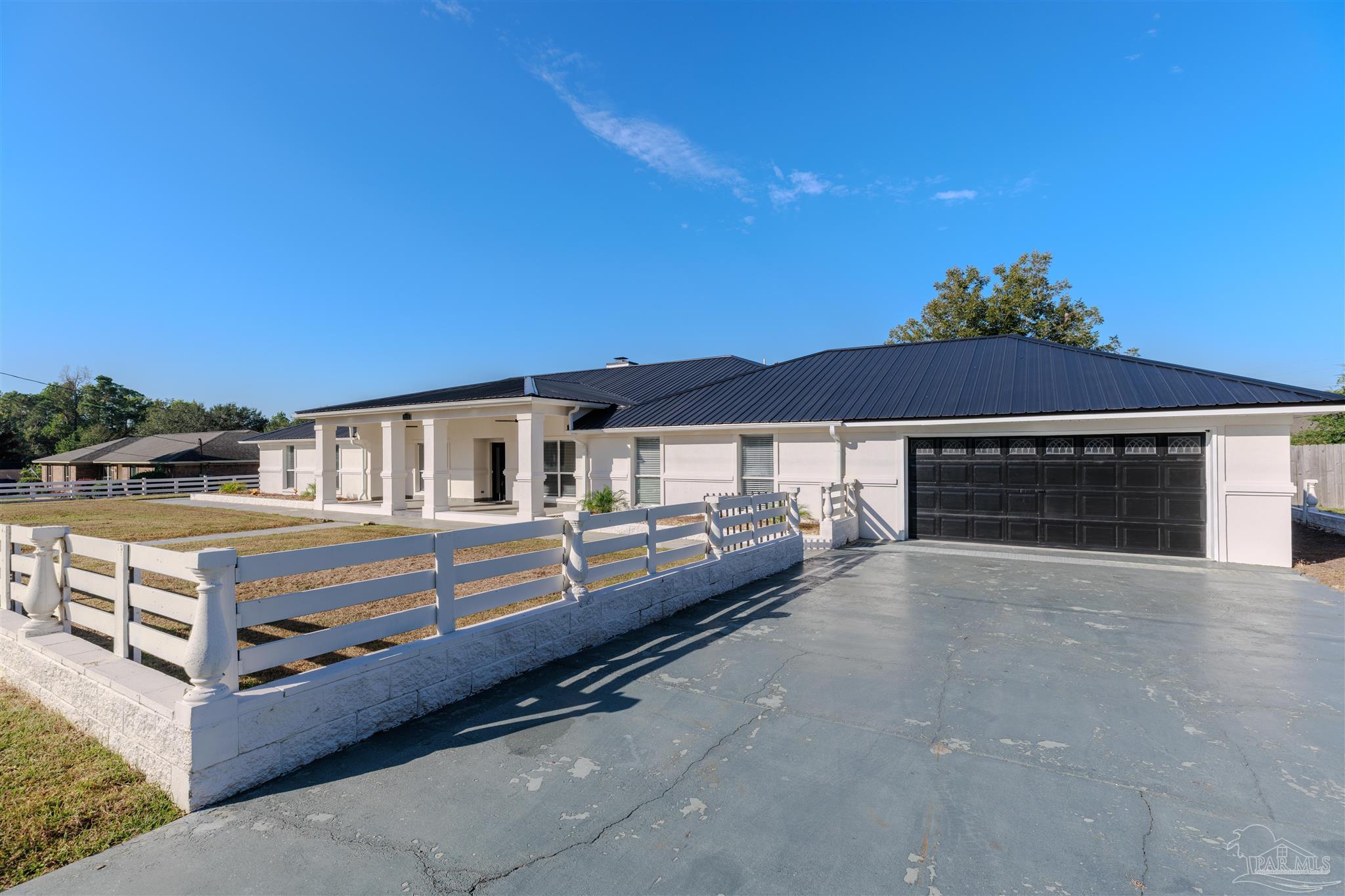2115 Stallion Road Cantonment, FL 32533 - Photo 3 of 70 a balcony with furniture and a fireplace