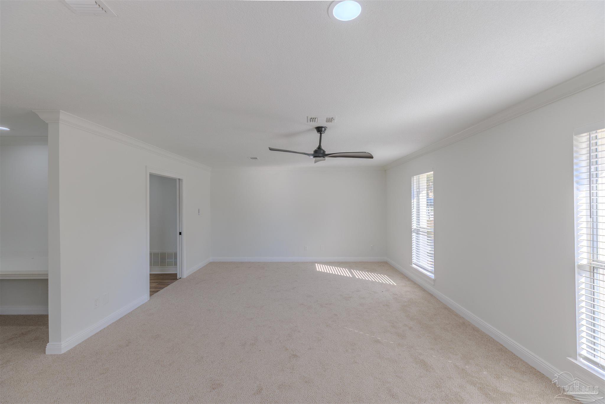 2115 Stallion Road Cantonment, FL 32533 - Photo 32 of 70 an empty room with a window and ceiling fan
