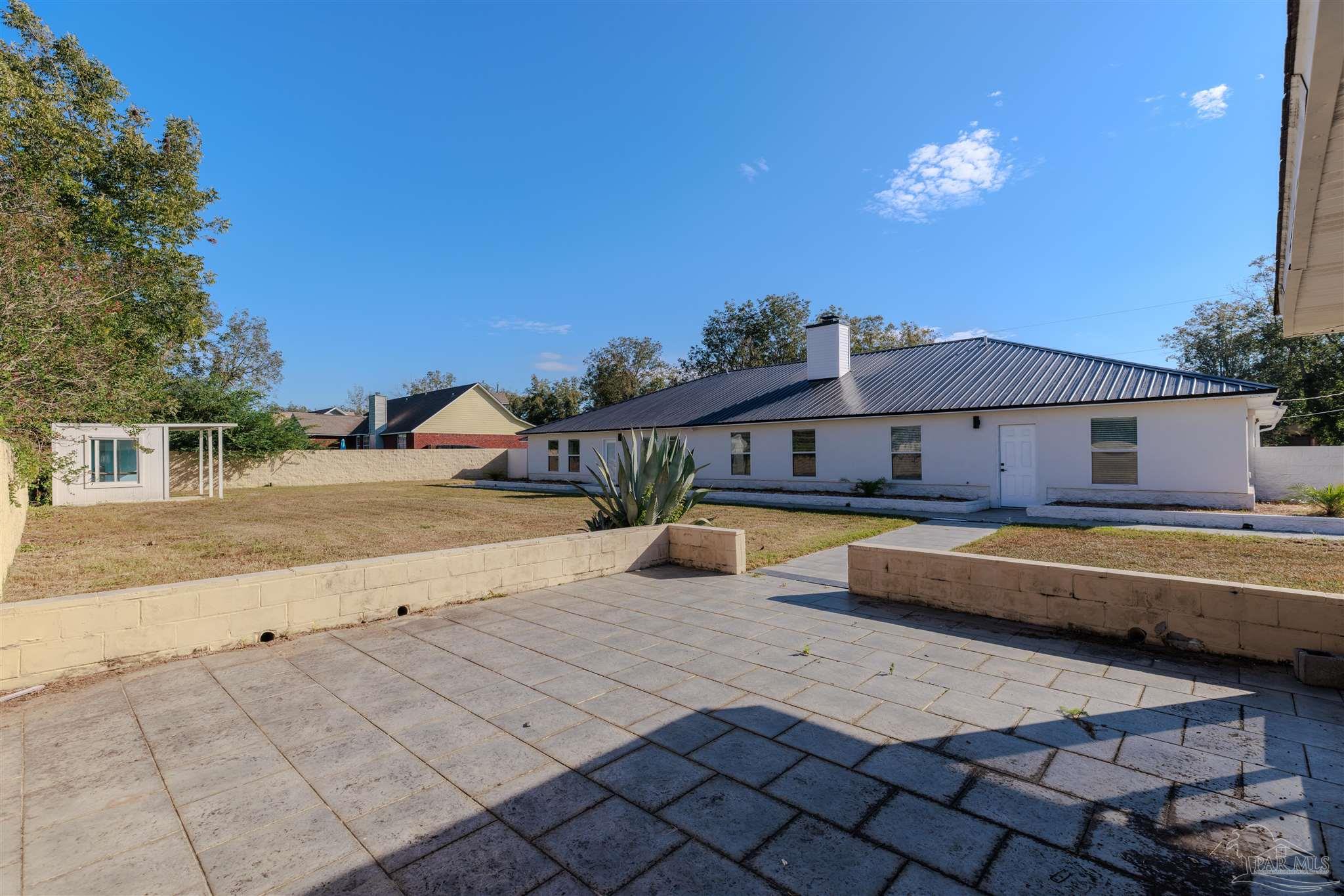 2115 Stallion Road Cantonment, FL 32533 - Photo 66 of 70 a view of a swimming pool with a lounge chairs