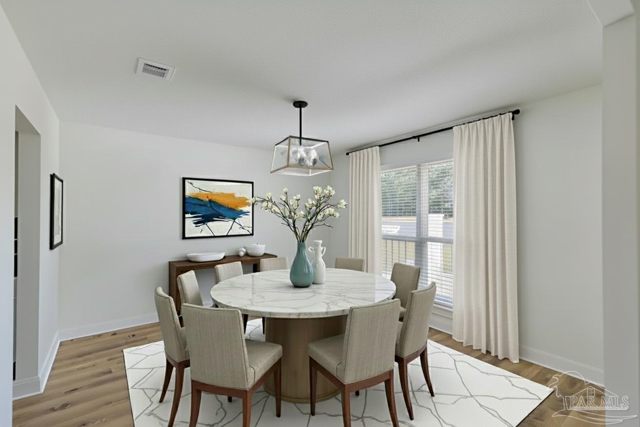 2115 Stallion Road Cantonment, FL 32533 - Photo 9 of 70 a dining room with furniture and window
