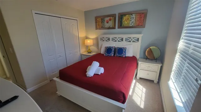 a room with a bed and furniture