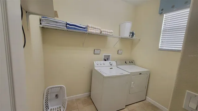 a utility room with dryer and washer