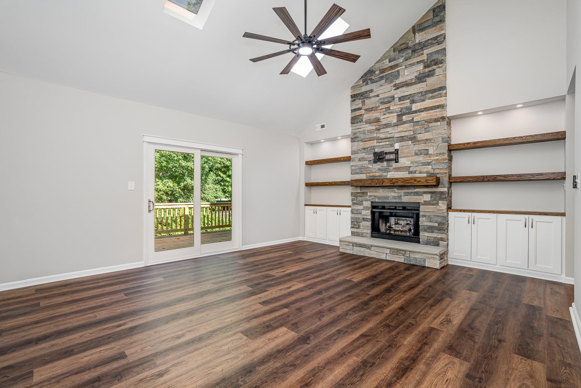 4924 Knightsbridge Way Raleigh, NC 27604 - Photo 6 of 27 wooden floor fireplace and windows in an empty room