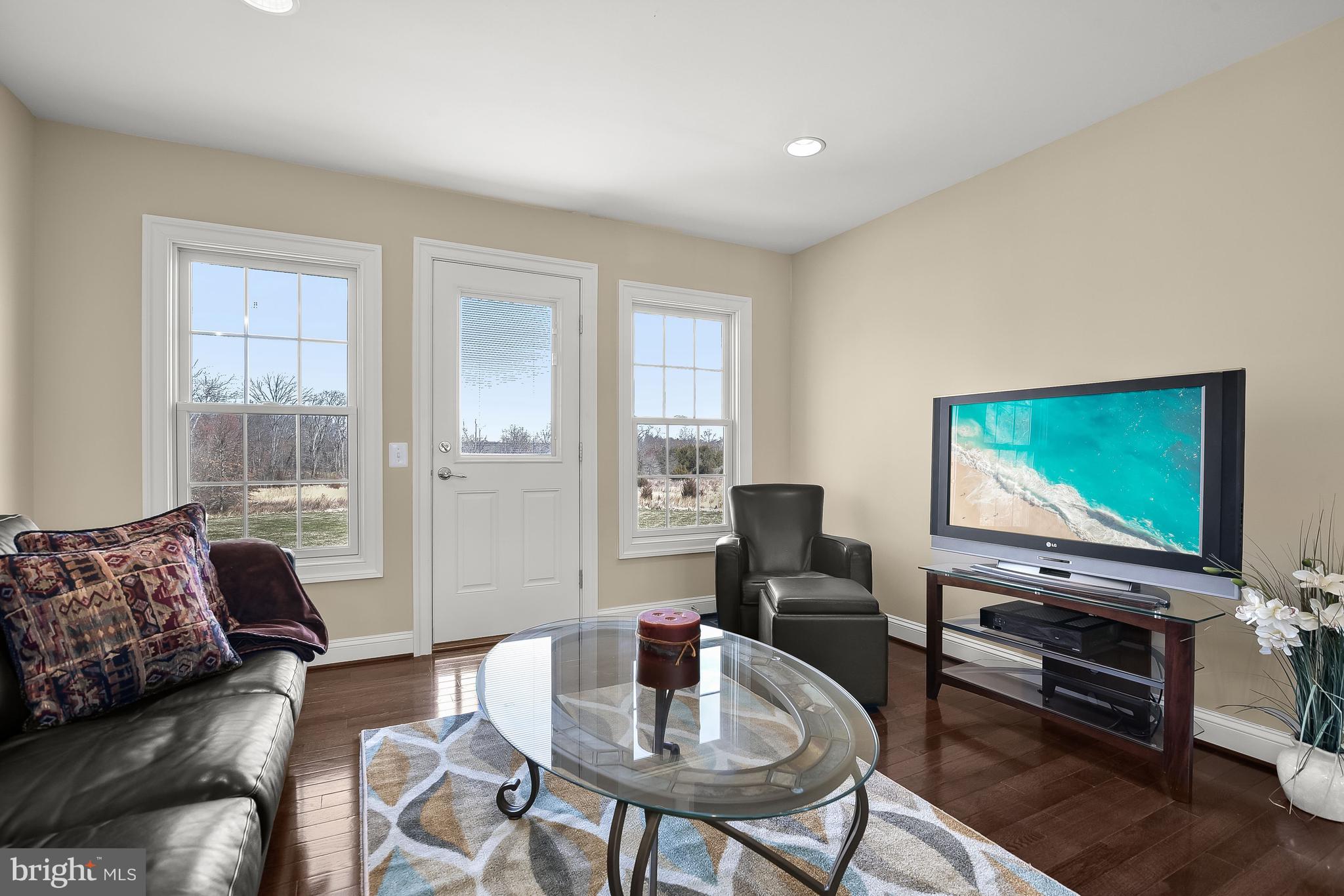 21151 Mill Branch Drive Leesburg, VA 20175 - Photo 106 of 132 a living room with furniture and a flat screen tv