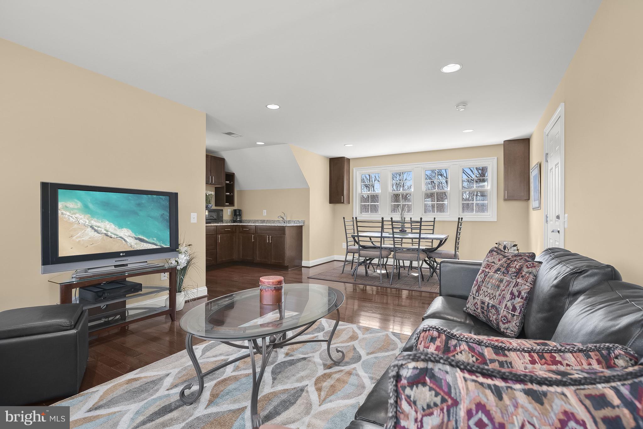 21151 Mill Branch Drive Leesburg, VA 20175 - Photo 107 of 132 a living room with furniture and a flat screen tv