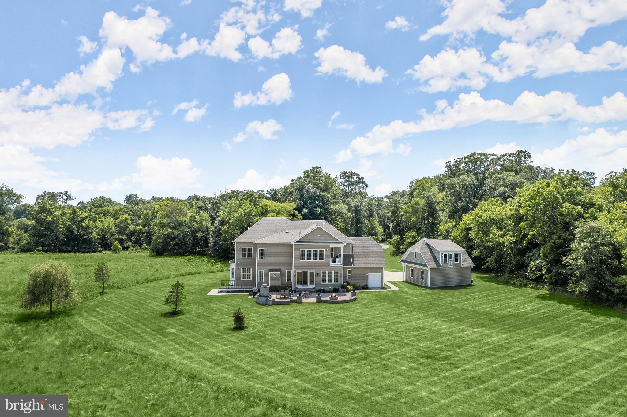 21151 Mill Branch Drive Leesburg, VA 20175 - Photo 113 of 132 a front view of a house with garden and trees