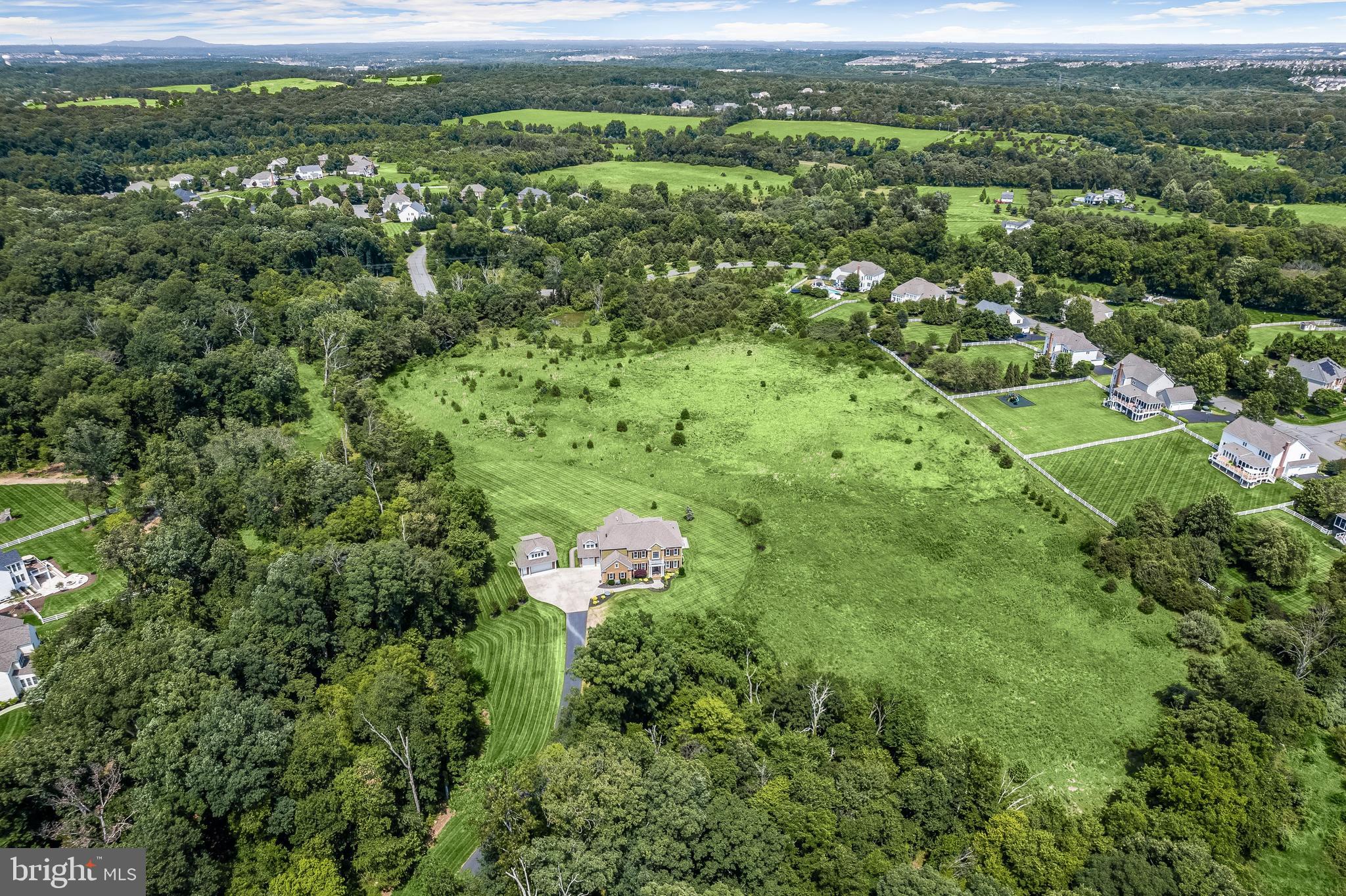 21151 Mill Branch Drive Leesburg, VA 20175 - Photo 123 of 132 a view of a green field with lots of bushes