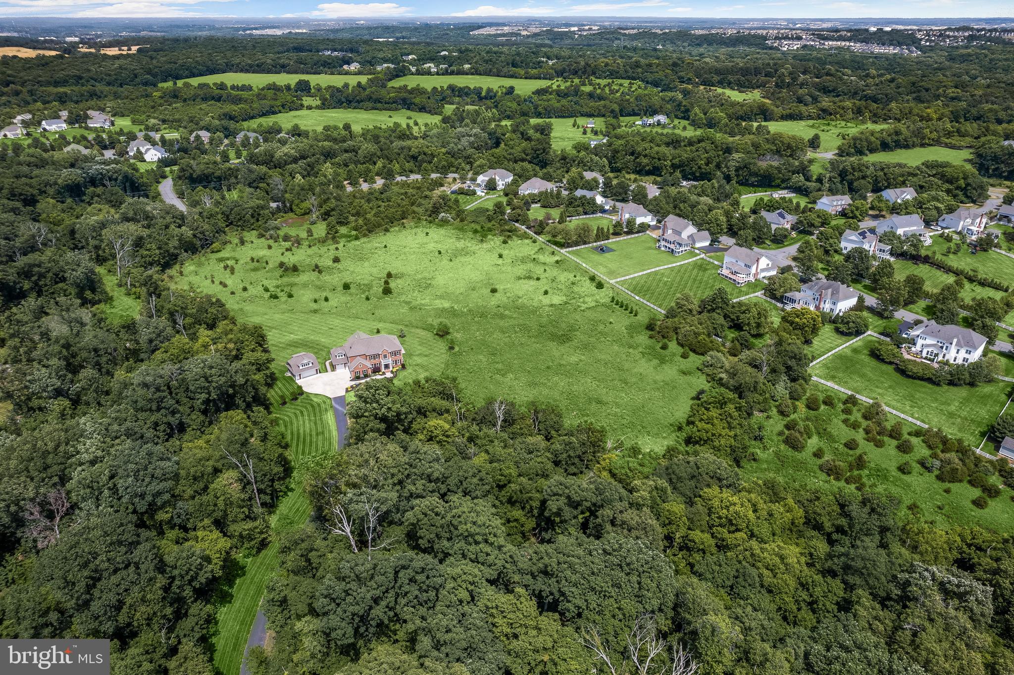 21151 Mill Branch Drive Leesburg, VA 20175 - Photo 124 of 132 an aerial view of residential houses with outdoor space and trees