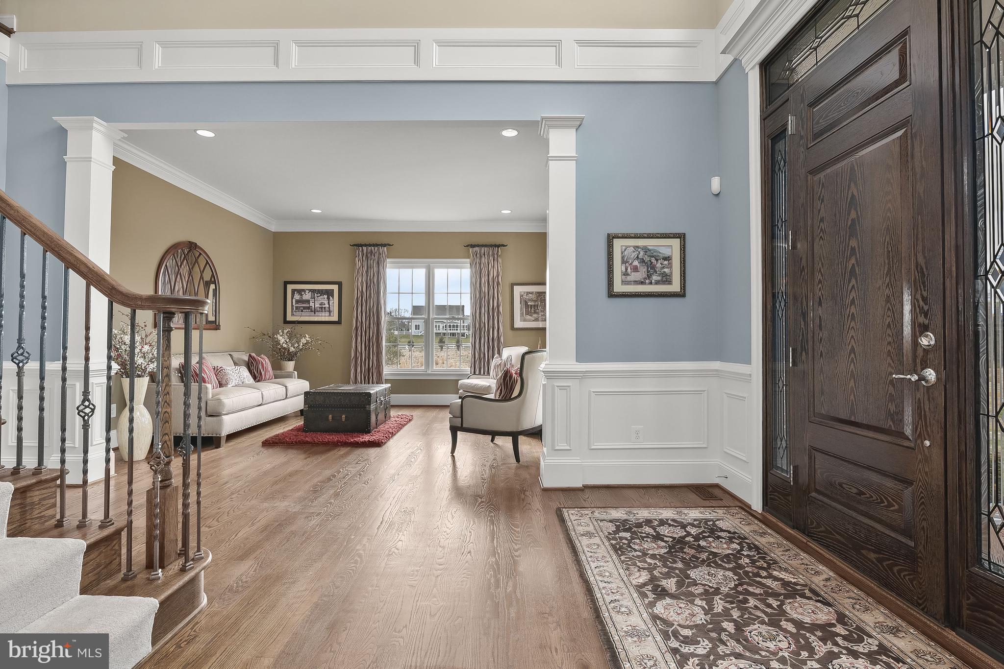 21151 Mill Branch Drive Leesburg, VA 20175 - Photo 16 of 132 a living room with furniture and a rug