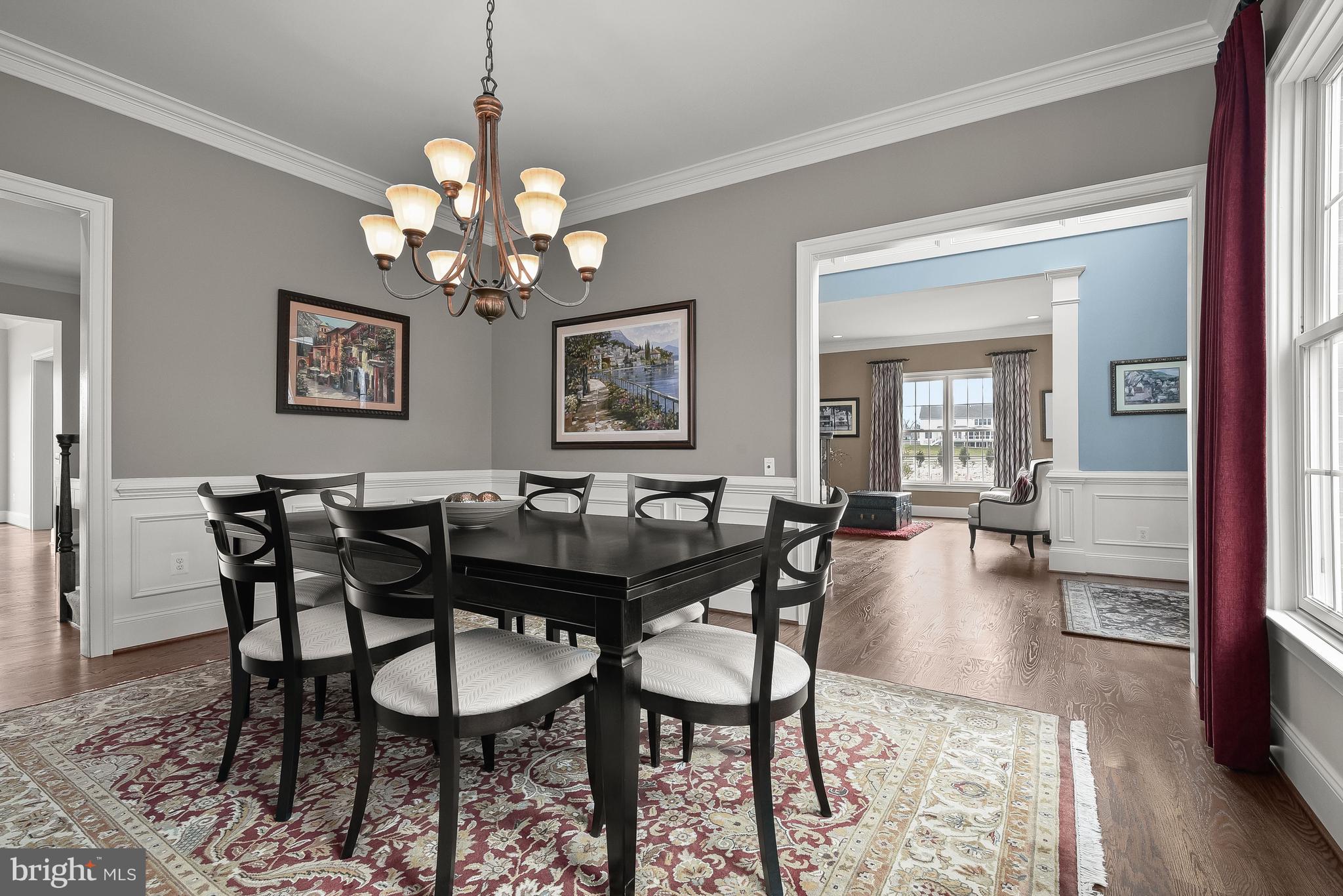21151 Mill Branch Drive Leesburg, VA 20175 - Photo 19 of 132 a view of a dining room with furniture and chandelier