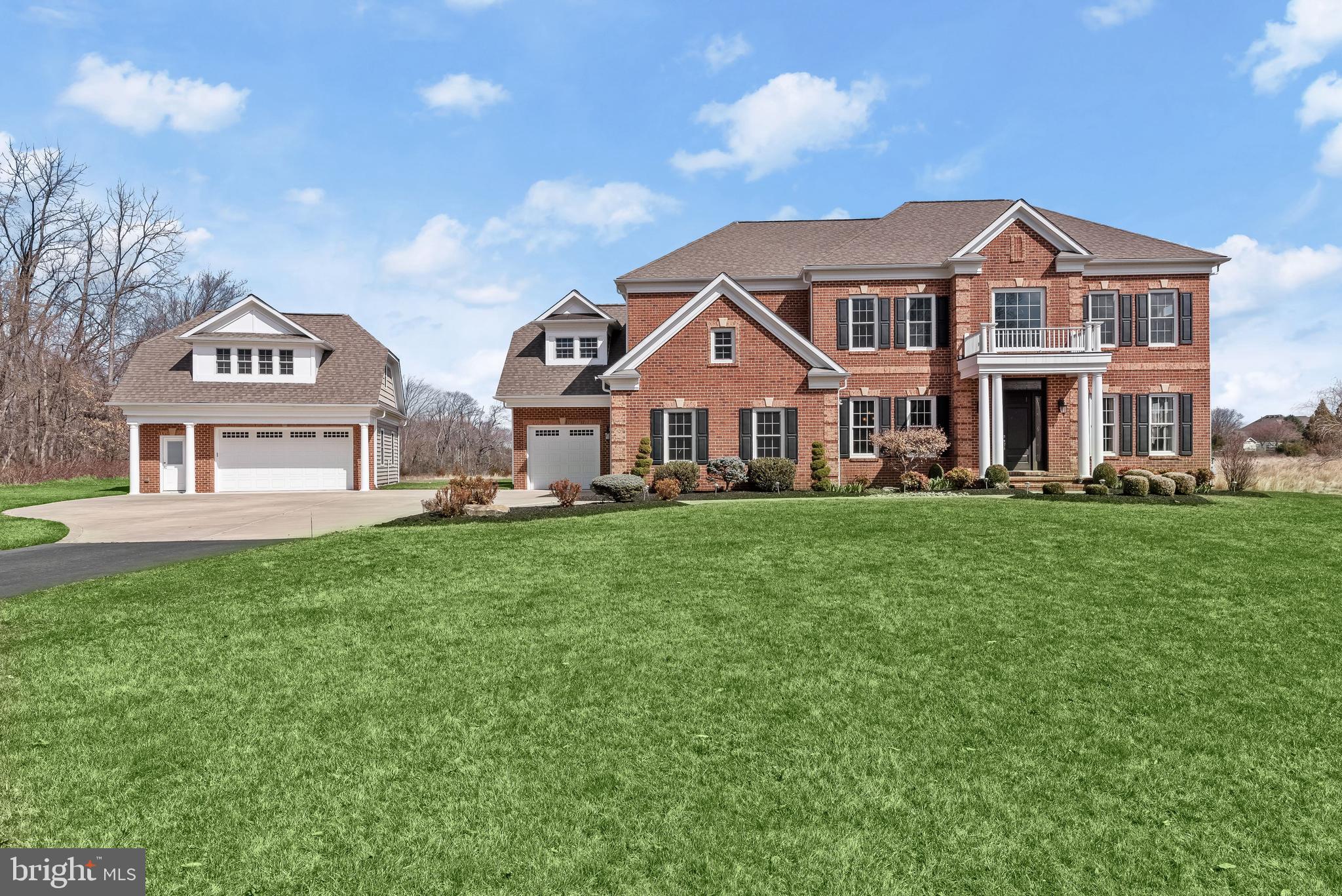 21151 Mill Branch Drive Leesburg, VA 20175 - Photo 3 of 132 a front view of a house with a yard