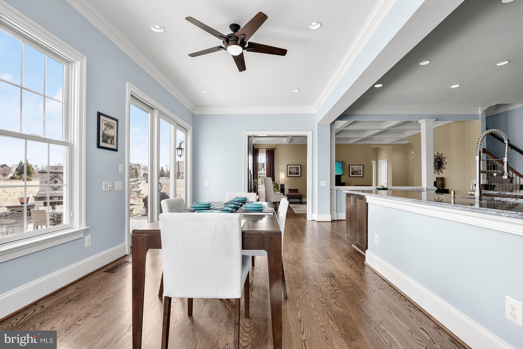 21151 Mill Branch Drive Leesburg, VA 20175 - Photo 33 of 132 a view of a dining room with furniture window and wooden floor