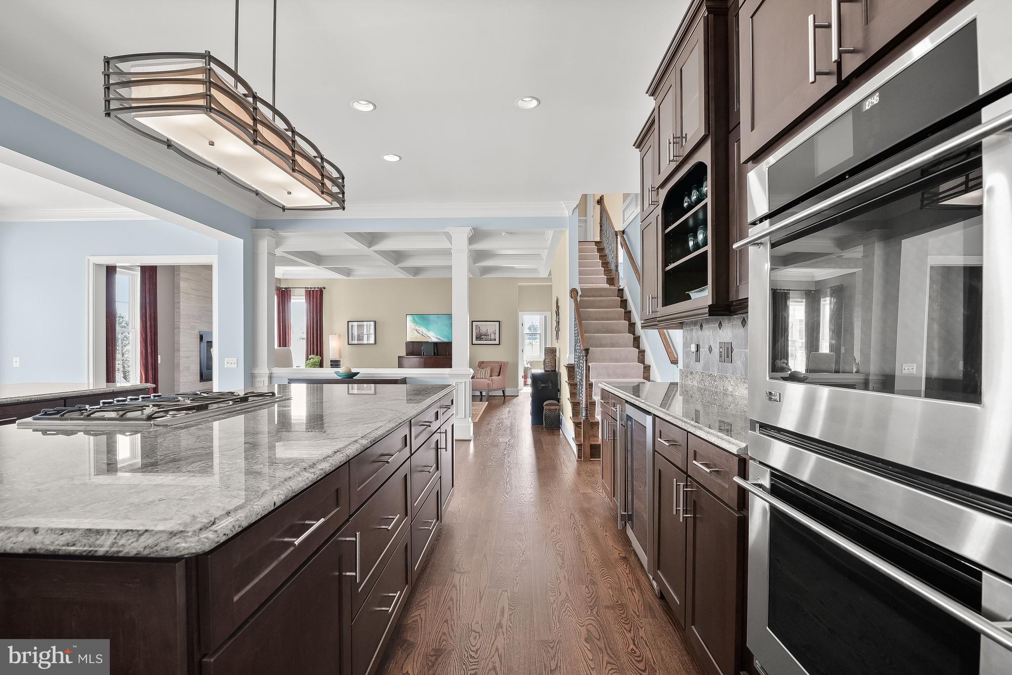 21151 Mill Branch Drive Leesburg, VA 20175 - Photo 40 of 132 a kitchen with stainless steel appliances granite countertop a sink and stove