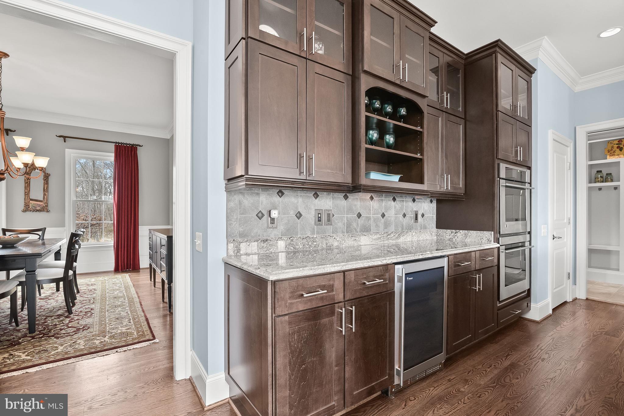 21151 Mill Branch Drive Leesburg, VA 20175 - Photo 41 of 132 a kitchen with stainless steel appliances granite countertop a stove and a sink