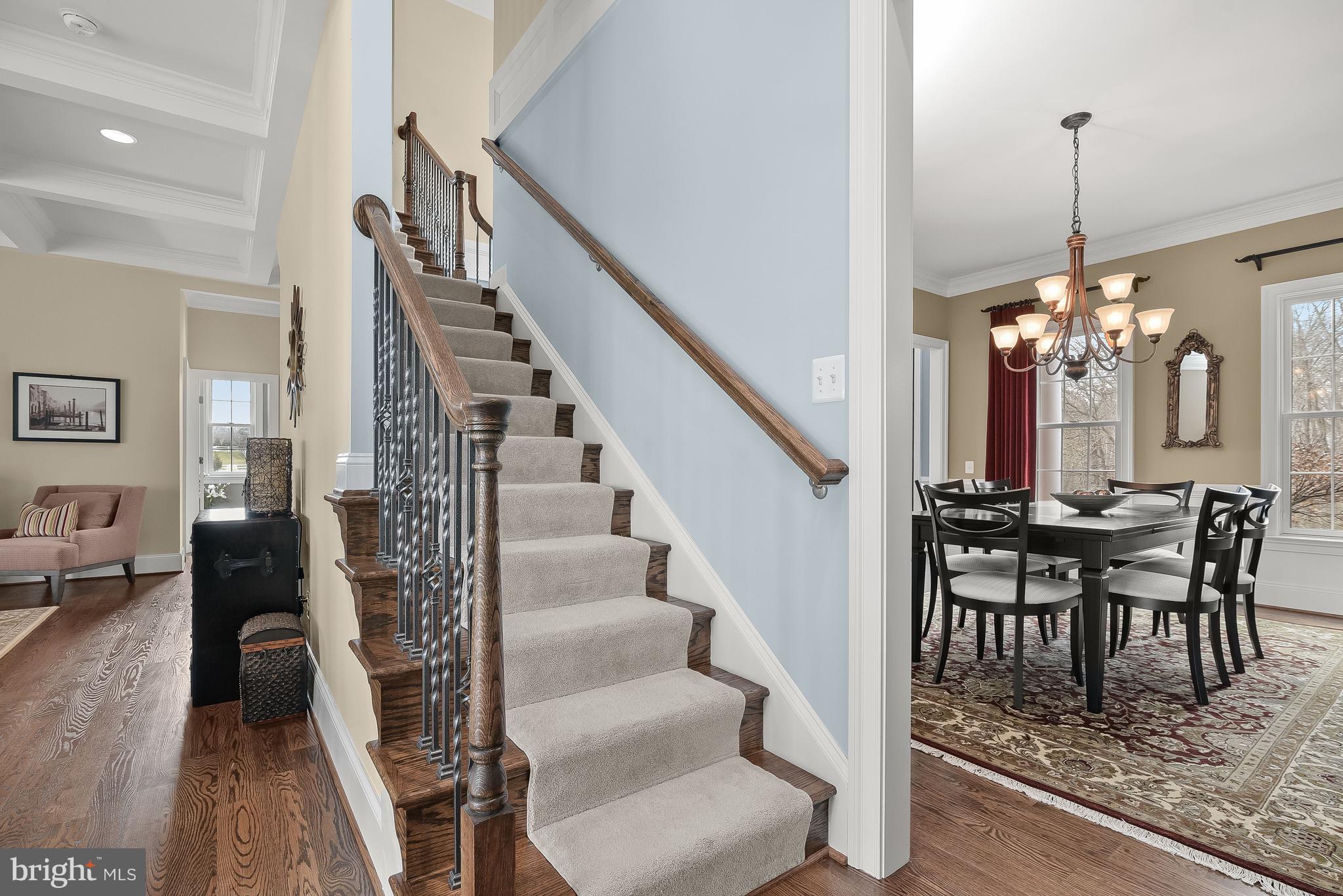 21151 Mill Branch Drive Leesburg, VA 20175 - Photo 45 of 132 a view of a livingroom with furniture staircase and wooden floor