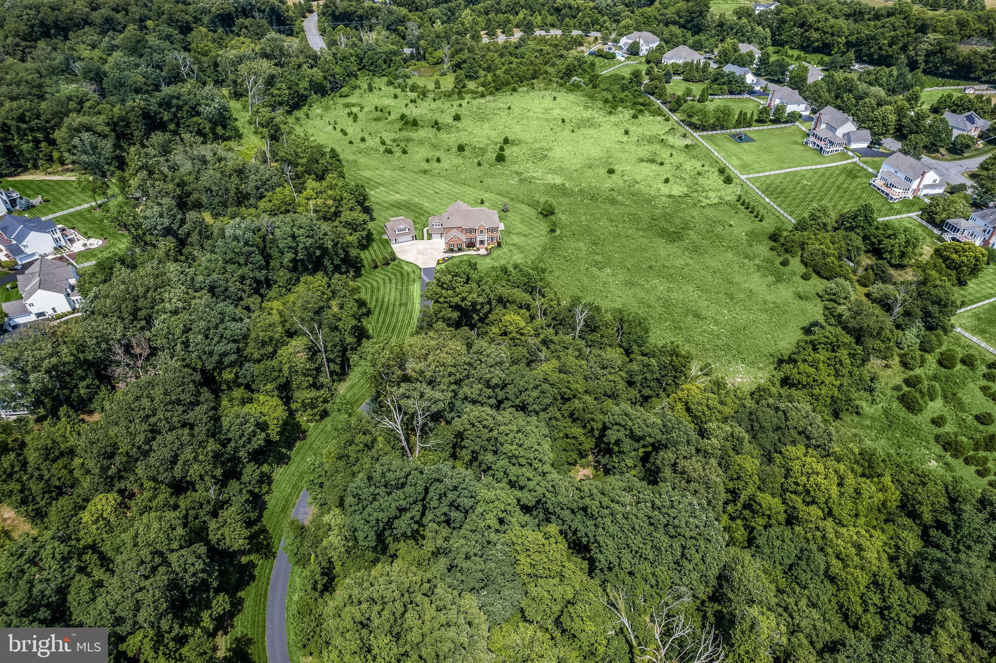 21151 Mill Branch Drive Leesburg, VA 20175 - Photo 6 of 132 an aerial view of residential house with outdoor space and trees all around
