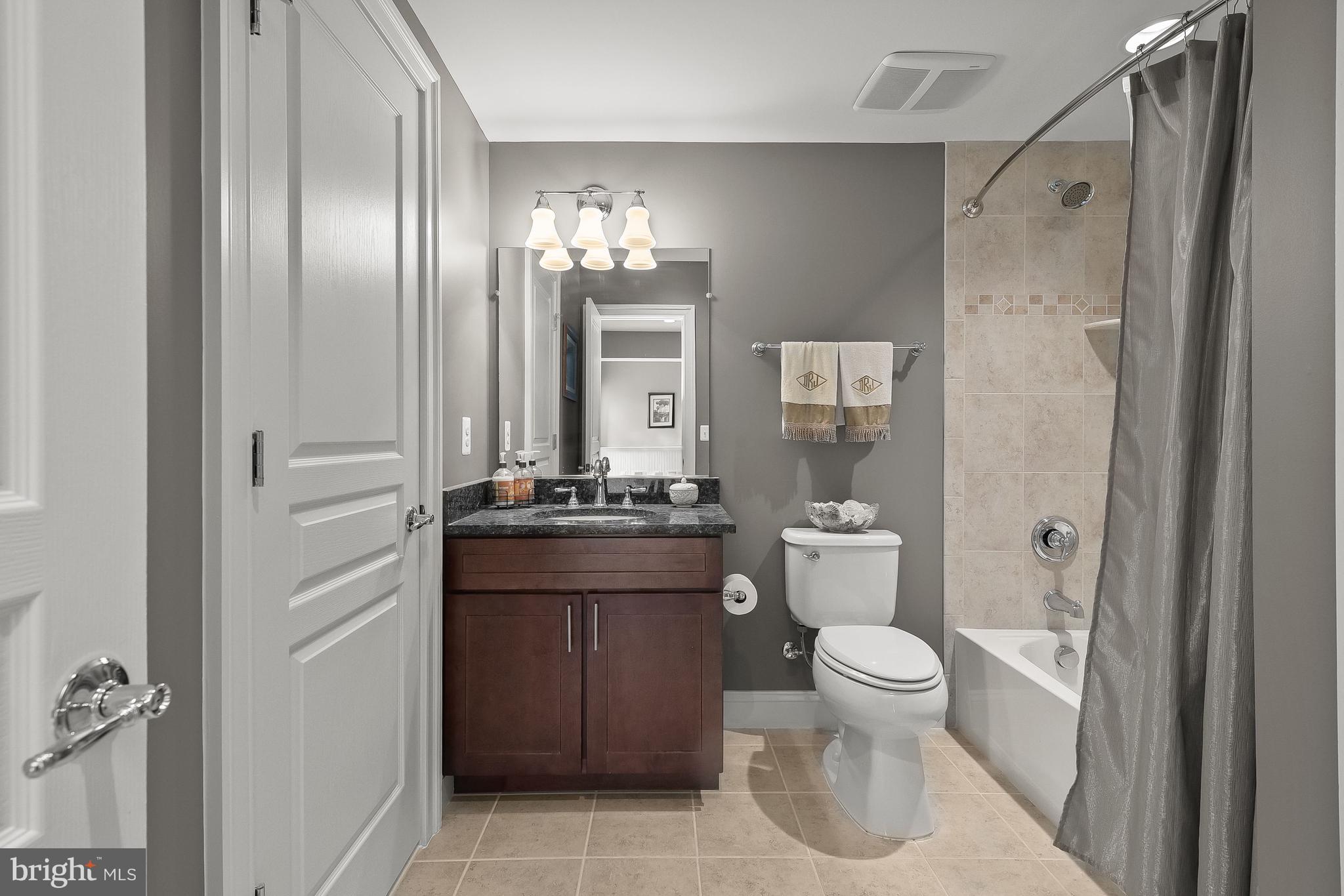 21151 Mill Branch Drive Leesburg, VA 20175 - Photo 85 of 132 a bathroom with a granite countertop sink toilet and shower