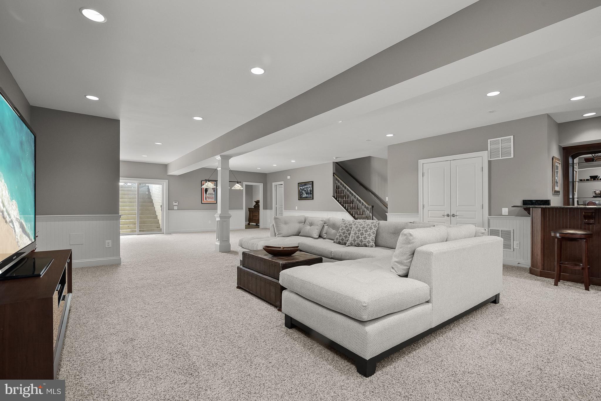 21151 Mill Branch Drive Leesburg, VA 20175 - Photo 88 of 132 a living room with furniture and a flat screen tv