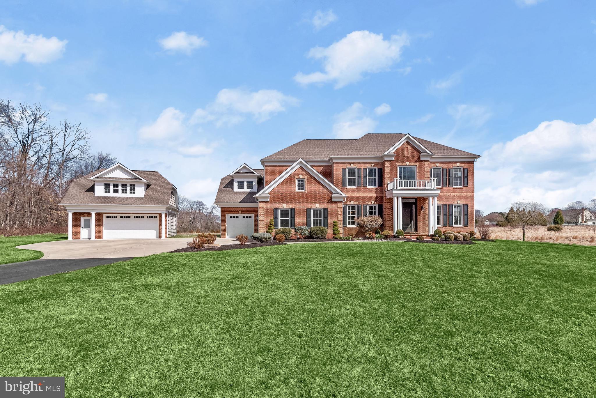 21151 Mill Branch Drive Leesburg, VA 20175 - Photo 9 of 132 a view of a house with a big yard and large trees