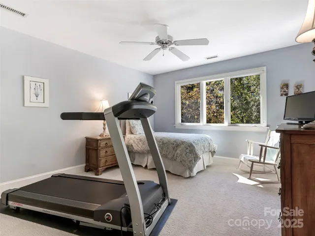 a bedroom with furniture and a window