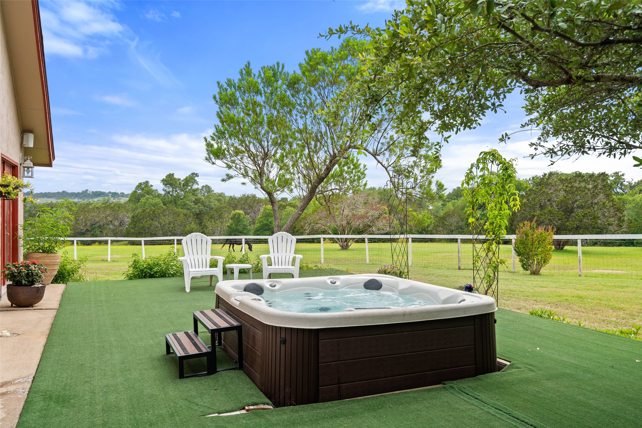 23200 Fulkes Road Leander, TX 78641 - Photo 12 of 15 A private outdoor spa retreat nestled in a verdant landscape awaits.