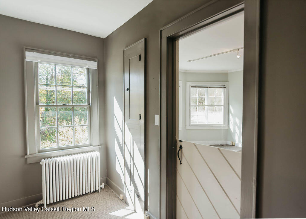 3927 Main Street Stone Ridge, NY 12484 - Photo 11 of 32 an empty room that has a window and a bath tub